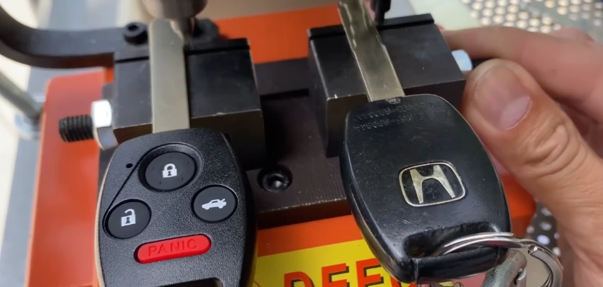 Locksmith technician cutting a replacement car key on-site in Duval County, FL